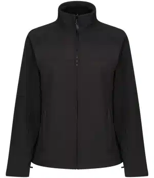 Regatta TRA645 Ladies' Uproar Softshell Jacket in black, featuring a high collar, two side pockets, and long sleeves, displayed on a plain white background. | Work & Wear DIrect