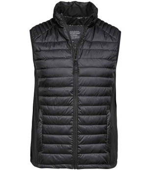 Tee Jays Men’s Crossover Bodywarmer (TJ9624) is a black, sleeveless padded gilet featuring quilted horizontal stitching, a high collar, and a front zip fastening. | Work & Wear DIrect