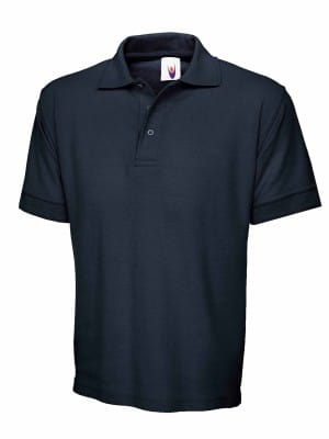The UC104 Uneek Ultimate Cotton Poloshirt is a plain black, short-sleeve polo featuring a collar and two buttons, shown on a white background. | Work & Wear DIrect