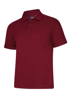 The Uneek Deluxe Poloshirt - UC108 is a plain, short-sleeved maroon polo shirt featuring a collar and three buttons down the front, displayed on a white background. | Work & Wear DIrect