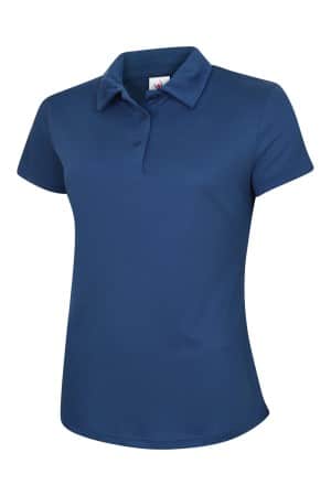 A short-sleeved, blue Uneek Ladies Ultra Cool Polo Shirt (UC126) for women, featuring a collar and two buttons, displayed on a plain white background. | Work & Wear DIrect