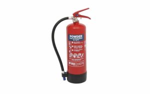 A Firechief XTR 4kg Powder Fire Extinguisher (FXP4), featuring a red body labelled "Powder" with a black hose and nozzle, stands upright on a white background. Instructions and warnings are printed on the front. | Work & Wear DIrect