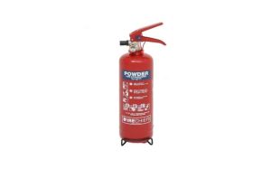 The Firechief XTR 2kg Powder Fire Extinguisher (FXP2) stands upright with a red body labelled "Powder," featuring a black base, red handle, attached hose, and white printed instructions on its surface. | Work & Wear DIrect
