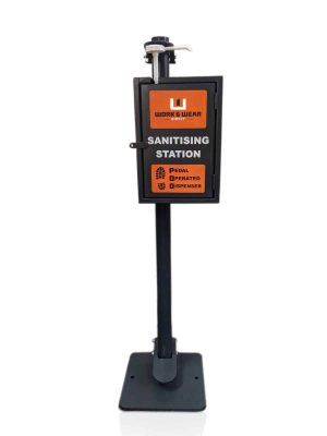 A black New P.O.D Plus™ (Pedal Operated Dispenser) with lockbox stands upright, featuring an orange sign that reads “SANITISING STATION” and “PEDAL OPERATED DISPENSER” above a foot icon. | Work & Wear DIrect